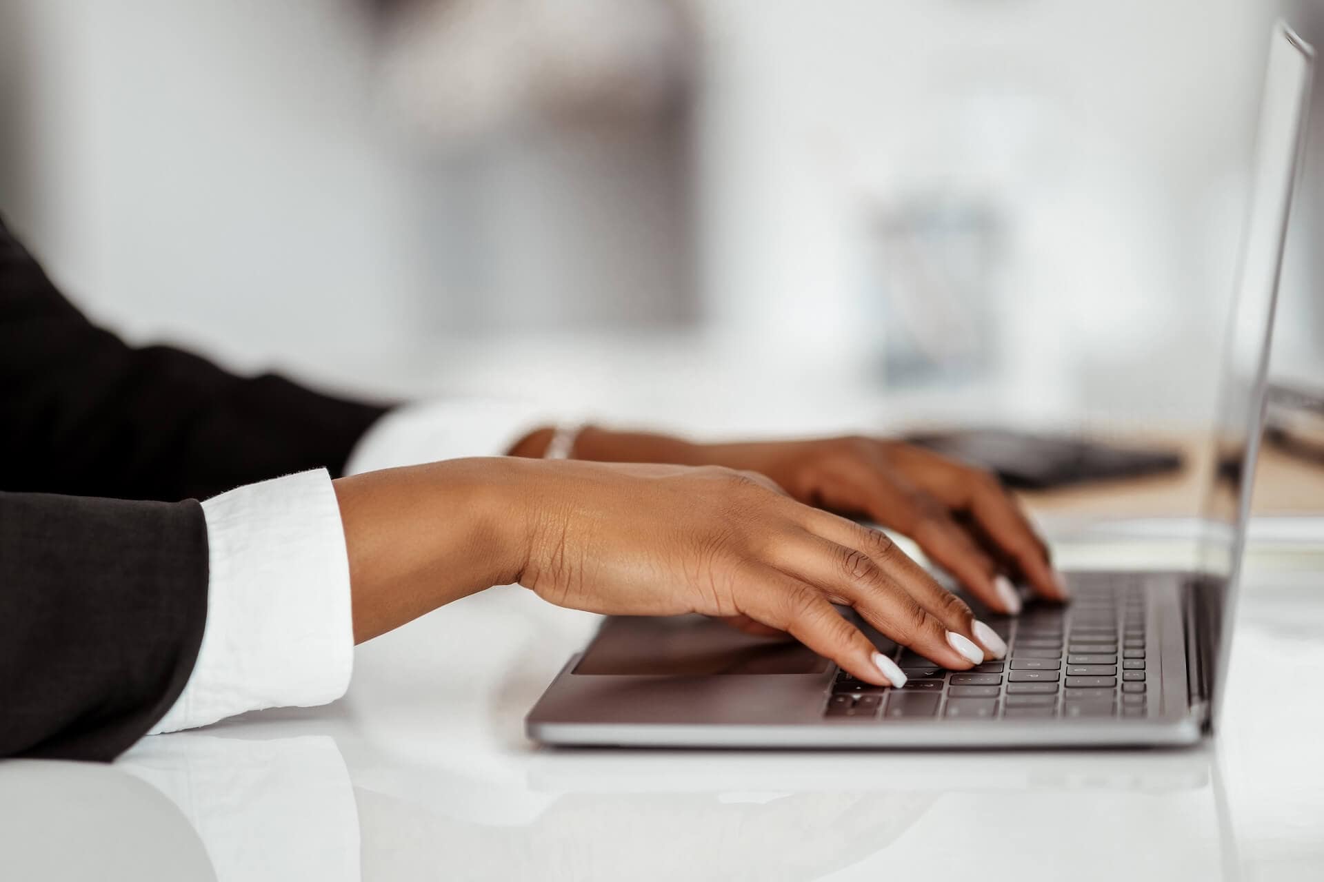 closeup of hands on laptop